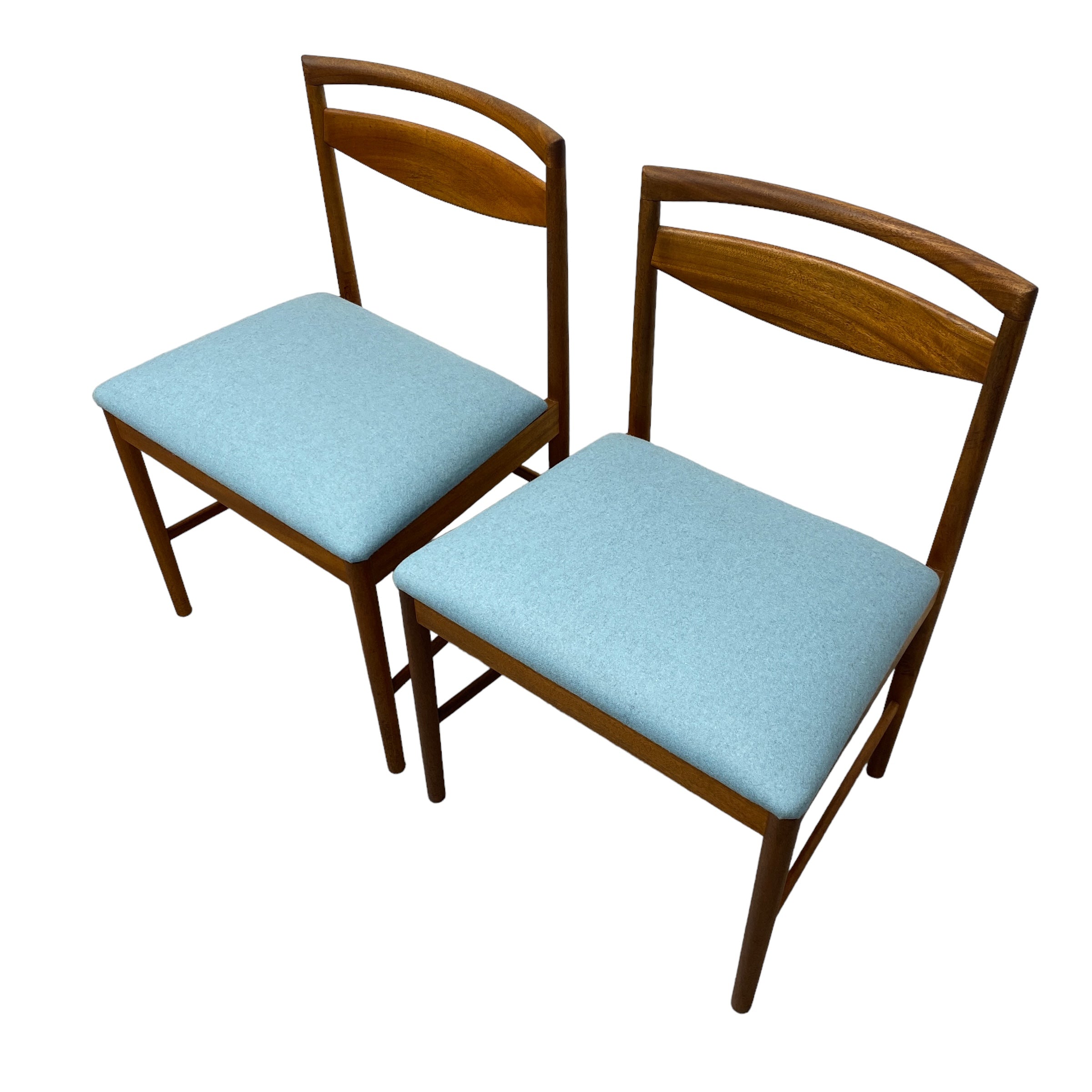 two teak dining chairs